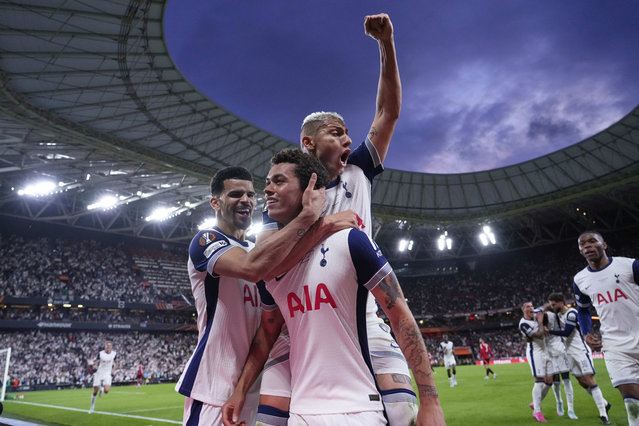 Tottenham's Brennan Johnson, centre, celebrates after scoring his side's opening goal during the Europa League final soccer match between Tottenham Hotspur and Manchester United at the San Mames Stadium in Bilbao, Spain, Wednesday, May 21, 2025. (Photo by Jose Breton/AP Photo)