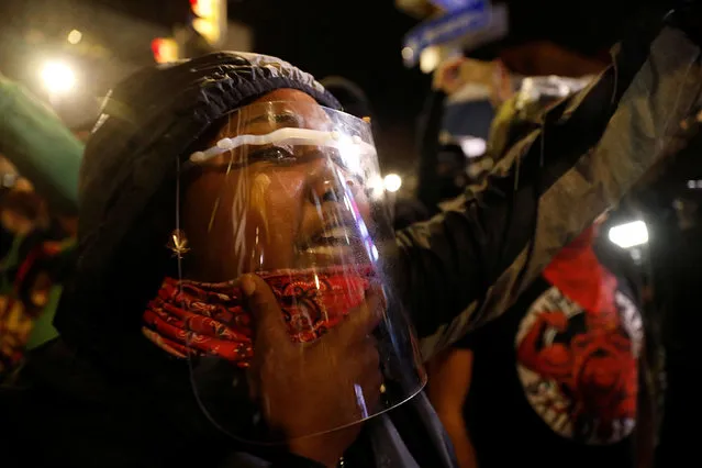 A demonstrator with a face shield takes part in a protest over the death of a Black man, Daniel Prude, after police put a spit hood over his head during an arrest on March 23, in Rochester, New York, U.S. on September 5, 2020. (Photo by Brendan McDermid/Reuters)