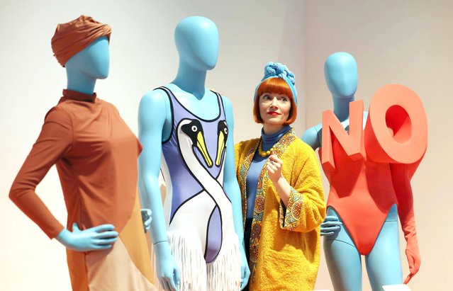 Amber Butchart, a dress and design historian, adjusts couture swimming costumes on March 24, 2025 that are part of a new exhibition called Splash! which opens at the Design Museum in London on March 28. (Photo by Richard Pohle/Times Media Ltd)
