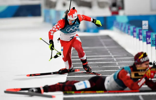 Christian Gow of Canada and Mario Dolder of Switzerland compete in the men' s 10 km sprint biathlon event during the Pyeongchang 2018 Winter Olympic Games on February 11, 2018, in Pyeongchang. (Photo by Toby Melville/Reuters)