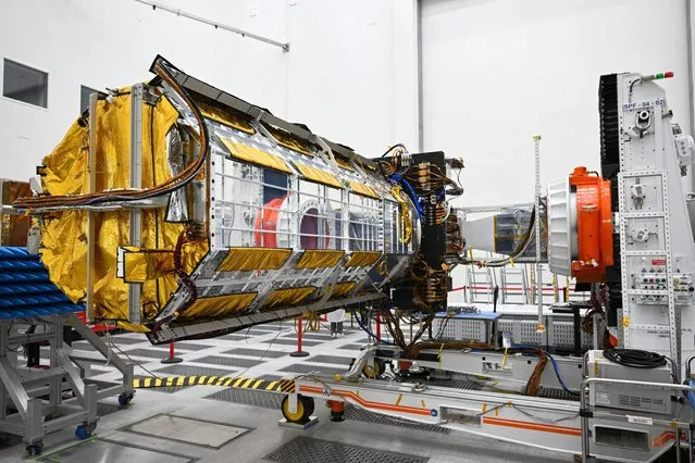 The NISAR satellite, a joint Earth-observing mission between NASA and the Indian Space Research Organization (ISRO), is displayed inside a clean room at NASA's Jet Propulsion Laboratory (JPL) in Pasadena, California on February 3, 2023. The NASA-ISRO Synthetic Aperture Radar satellite will measure changes in Earth's surface topography and create high-resolution images to track the evolution of Earth's crust, observing the flow rates of glaciers, the dynamics of earthquakes and volcanos, studying climate change, and changes to croplands. (Photo by Patrick T. Fallon/AFP Photo)