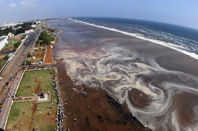 The aerial view of Marina beach after a tsunami triggered by an earthquake in the Indian Ocean hit the area in the southern Indian city of Madras in this December 26, 2004 file photo. (Photo by Reuters/Babu)