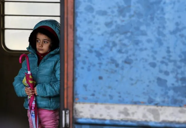 A migrant child stands in a train cabin on arrival near the border with Serbia, at a railway station in Tabanovce, Macedonia October 24, 2015. (Photo by Ognen Teofilovski/Reuters)