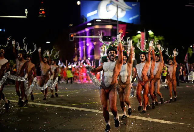 People participate in the annual Gay and Lesbian Mardi Gras parade in Sydney on March 3, 2018. Rainbow colours beamed from faces and floats parading through Sydney March 3 as hundreds of thousands of partygoers celebrated 40 years of the annual Gay and Lesbian Mardi Gras. (Photo by  Saeed Khan/AFP Photo)
