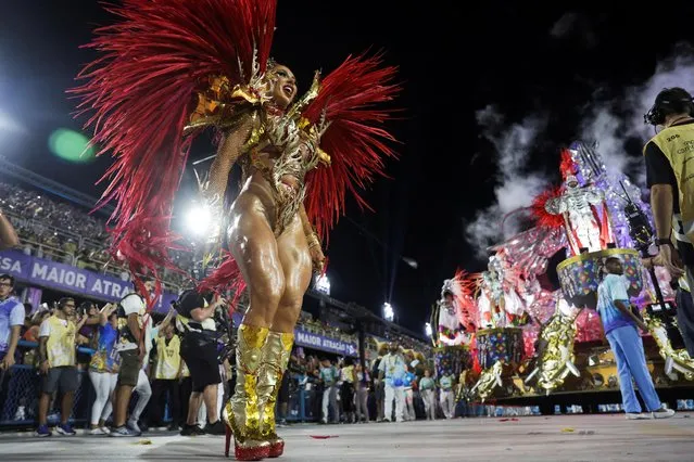 A reveler from Vila Isabel samba school performs during the second night of the carnival parade at the Sambadrome, in Rio de Janeiro, Brazil on February 21, 2023. (Photo by Pilar Olivares/Reuters)