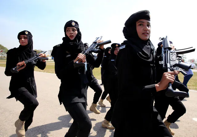 Female members of police commando march during a ceremony on International Women's Day, at the police headquarters in Islamabad, Pakistan March 8, 2018. (Photo by Faisal Mahmood/Reuters)