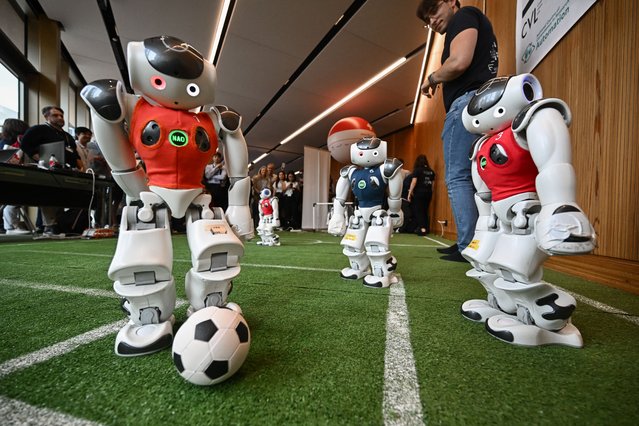 Robots of the Zurich Federal Institute of Technology play a football game during the International Telecommunication Union (ITU) AI for Good Global Summit in Geneva on May 30, 2024. (Photo by Fabrice Coffrini/AFP Photo)