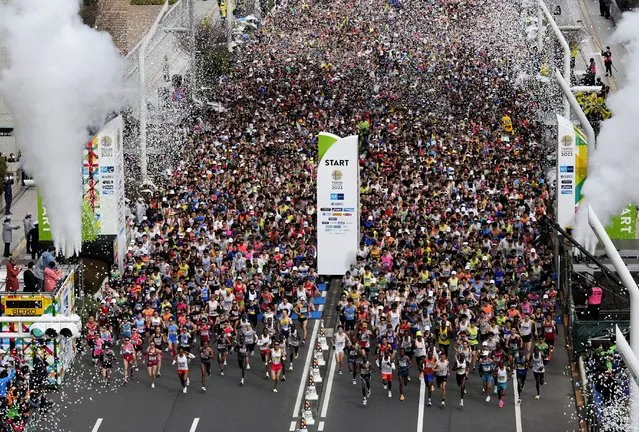 Runners fill the street in front of the Tokyo Metropolitan Government Building at the start of the Tokyo Marathon Sunday, March 5, 2023, in Tokyo. (Photo by Franck Robichon/Pool Photo via AP Photo)