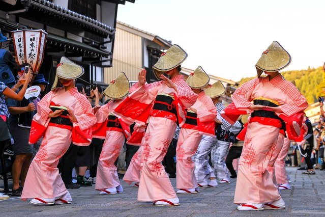 Women wearing braided straw hats dance as the Owara Kaze-no-Bon dance festival begins on September 1, 2025 in Toyama, Japan. The festival, believed to have more than 300 years history, continues till September 3. (Photo by The Asahi Shimbun via Getty Images)