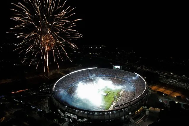 Aerial view of fireworks exploding before the start of the friendly football match between Argentina and Panama, at the Monumental stadium in Buenos Aires, on March 23, 2023. (Photo by Emiliano Lasalvia/AFP Photo)