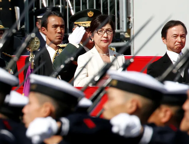 Japan's Defense Minister Tomomi Inada (C) reviews Japanese Self-Defence Forces' (SDF) troops during the annual SDF ceremony at Asaka Base, Japan, October 23, 2016. (Photo by Kim Kyung-Hoon/Reuters)