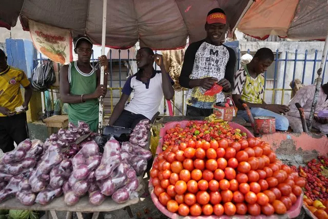 People sells tomatoes and onions at a market in Lagos, Nigeria Monday, February 27, 2023Sunday Alamba