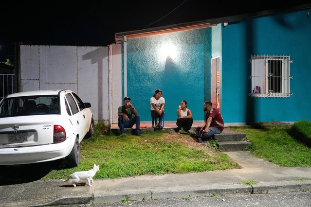 Gabriela Villanueva, third from left, and her husband Juan Guedez, right, sit with her in-laws outside their home in Araure, Venezuela, June 11, 2025. The couple traveled by land from Chile to Mexico, crossing the Darien Gap in an attempt to reach the U.S., but returned home after the Trump administration closed the border to asylum seekers. (Photo by Matias Delacroix/AP Photo)