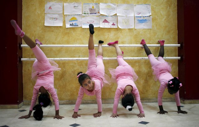 Palestinian girls take part in a ballet dancing course, run by the Al-Qattan Center for Children, in Gaza City November 25, 2015. (Photo by Suhaib Salem/Reuters)