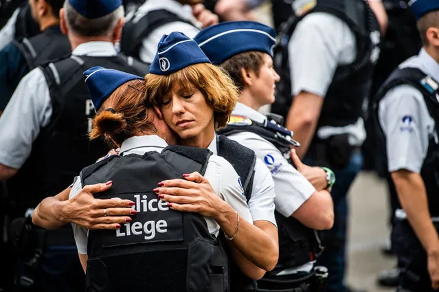 Police officers comfort each other in Liège, Belgium on June 5, 2018 during a funeral service for their colleagues Lucille Garcia and Soraya Belkacemi, who were killed in gun attack last week. (Photo by Isopix/Rex Features/Shutterstock)