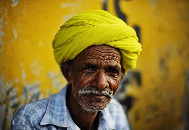 “Portrait of man in a citron green turban”. Rajasthan is widely recognized for its charming and elegant colourful turbans. I saw this Local man sitting on the street, he wearing a citron green turban, the colour blended into background painted wall. I thought it's nice, took this shot. Location: Udaipur, Rajasthan, India. (Photo and caption by Xuesong Liao/National Geographic Traveler Photo Contest)