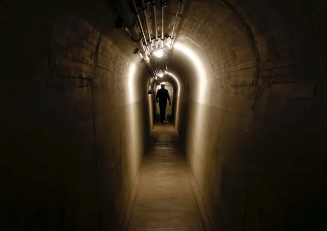 A tunnel connects the bunkers at a former Swiss Army artillery fort in Faulensee, Switzerland October 19, 2015. Artillery fort Faulensee was in military use from 1943 to 1993 and is now open to the public as a museum. (Photo by Arnd Wiegmann/Reuters)