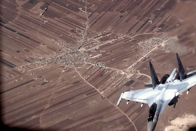 In this image from video released by the U.S. Air Force, a Russian SU-35 flies near a U.S. Air Force MQ-9 Reaper drone on Wednesday, July 5, 2023, over Syria. The U.S. Air Force says Russian fighter jets flew dangerously close to several U.S. drone aircraft over Syria, setting off flares and forcing the MQ-9 Reapers to take evasive maneuvers. (Photo by U.S. Air Force via AP Photo)