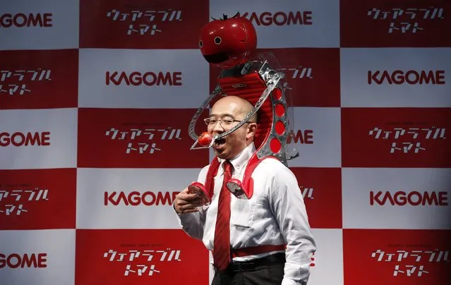 Kagome Co's employee Shigenori Suzuki poses with the newly-developed “Wearable Tomato” device for runners during its unveiling event ahead of the weekend's Tokyo Marathon in Tokyo February 19, 2015. (Photo by Toru Hanai/Reuters)