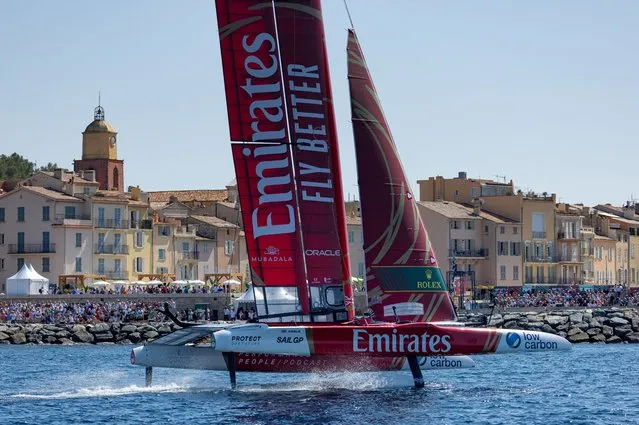 Emirates Great Britain SailGP Team helmed by Ben Ainslie sail past the bell tower and old town of Saint-Tropez and spectators at the seawall grandstand and race stadium on Race Day 2 of the France Sail Grand Prix in Saint-Tropez, France on September 10, 2023. (Photo by Felix Diemer for SailGP/PA Wire)