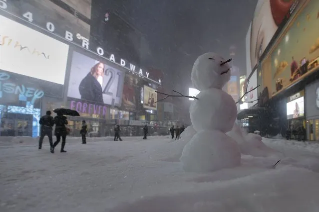A snowman is pictured in Times Square in the Manhattan borough of New York, January 23, 2016. (Photo by Carlo Allegri/Reuters)