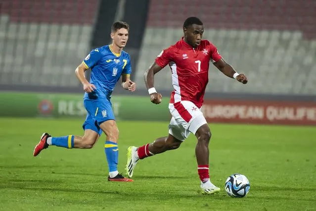 Malta's Joseph Mbong, right, challenges for the ball with Ukraine's Georgiy Sudakov during the Euro 2024 group C qualifying soccer match between Malta and Ukraine at the National Stadium in Ta' Qali, near Valletta, Malta, Tuesday, October 17, 2023. (Photo by Rene Rossignaud/AP Photo)