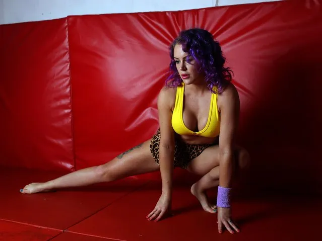 Professional wrester “Amethyst Hammerfist” warms up her muscles ahead of her BDSM wrestling session with client Wilfred at The Submission Room session wrestling and BDSM gym in Seven Sisters, on December 12, 2016 in London, England. (Photo by Susannah Ireland/Barcroft Images)