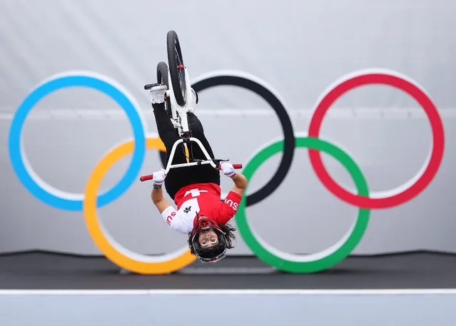 Nikita Ducarroz of Team Switzerland performs a blackflip in front of the Olympic ring logo during the Women's BMX Freestyle seeding event, run 2 on day eight of the Tokyo 2020 Olympic Games at Ariake Urban Sports Park on July 31, 2021 in Tokyo, Japan. (Photo by Laurence Griffiths/Getty Images)