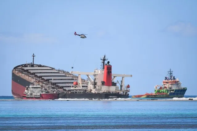 The vessel MV Wakashio, belonging to a Japanese company but Panamanian-flagged, that ran aground and caused oil leakage is seen near Blue bay Marine Park in southeast Mauritius on August 11, 2020. (Photo by Sumeet Mudhoo/L'Express Maurice/AFP Photo)
