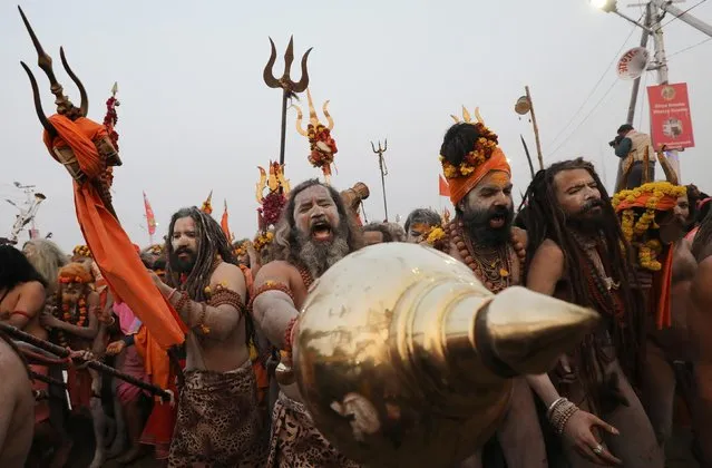 Naga Sadhus or Hindu holy men arrive to take a holy dip during the second “Shahi Snan” (grand bath) at the “Kumbh Mela” or the Pitcher Festival, in Prayagraj, previously known as Allahabad, India, February 4, 2019. (Photo by Anushree Fadnavis/Reuters)