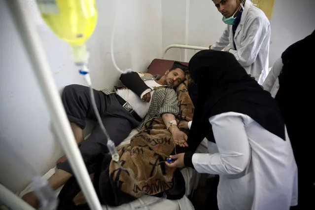 Medics treat an injured man from recent a Saudi-led airstrike, at a hospital in Sanaa, Yemen, Tuesday, April 21, 2015. The Saudi-led coalition pounded Shiite rebels in Yemen on Tuesday, killing at least 19 in a city in the country's west, officials said. (Photo by Hani Mohammed/AP Photo)