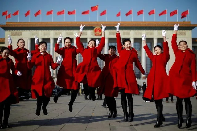 Attendants pose for pictures outside the Great Hall of the People in Beijing, China on March 5, 2019. (Photo by Aly Song/Reuters)