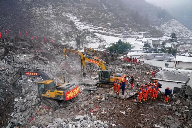 Rescue workers search for missing victims at a landslide site, a day after a landslide hits Liangshui village in Zhaotong, in southwestern China's Yunnan province on January 23, 2024. (Photo by CNS/AFP Photo)