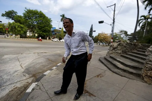 A man smiles as he jokes on a street in Havana city, Cuba, March 17, 2016. (Photo by Ivan Alvarado/Reuters)