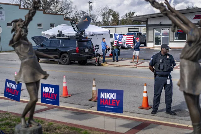 Donald Trump supporters stand across the street from Republican Presidential candidate Nikki Haley’s rally at the Moncks Corner Train Depot in Moncks Corner, South Carolina on Friday, February 23, 2024. (Melina Mara/The Washington Post)