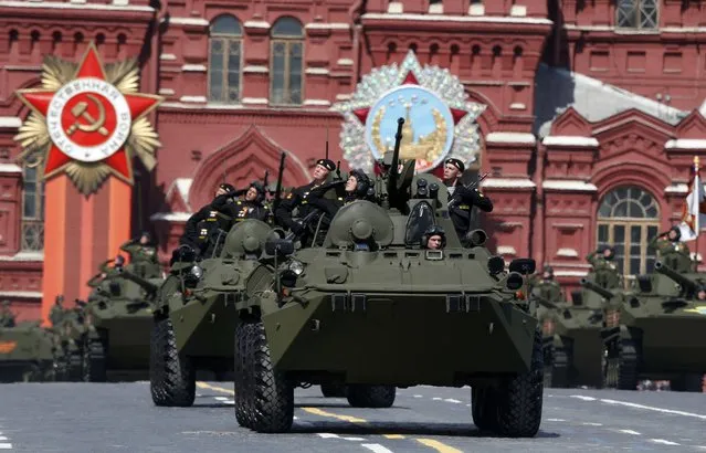 Russian servicemen drive BTR-82A armoured personnel carriers (APC) during the Victory Day parade at Red Square in Moscow, Russia, May 9, 2015. (Photo by Sergei Karpukhin/Reuters)