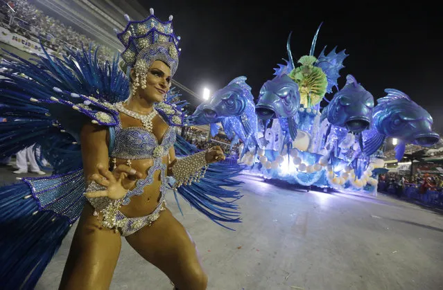 Performers from the Salgueiro samba school parade during carnival celebrations at the Sambadrome in Rio de Janeiro, Brazil, Monday, March 3, 2014. (Photo by Nelson Antoine/AP Photo)