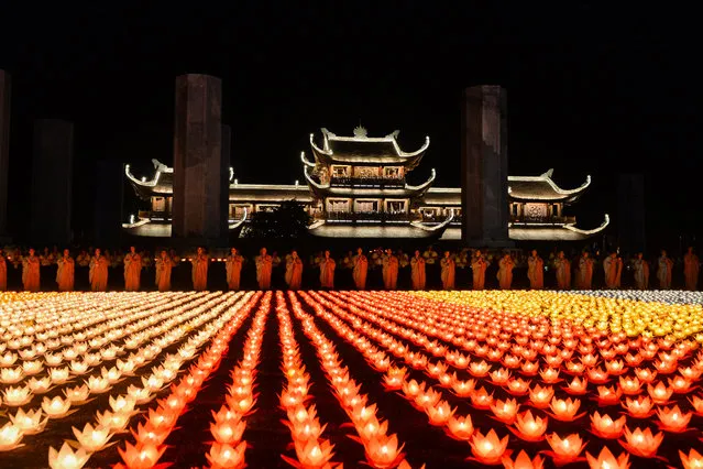 Buddhist nuns pray during a ceremony at the Tam Chuc pagoda in Ha Nam province on May 13, 2019, ahead of Vesak Day celebrations. (Photo by Nhac Nguyen/AFP Photo)