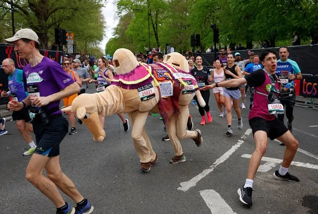 Tom and Becky Raftery got over the hump, completing the race dressed as a camel at London Marathon in London, Britain on April 21, 2024. (Photo by John Sibley/Reuters)