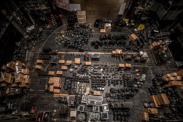 A worker walks between spotlights that are prepared for removal backstage during the symbolic start of the reconstruction of the State Opera in Prague, Czech Republic, 13 March 2017. The reconstruction and restoration works of Prague's State Opera are planned to take 27 months with costs of about 858 million Czech crowns (32 million euros). (Photo by Martin Divisek/EPA)
