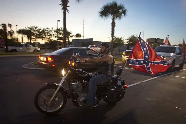 A man rides a motorcycle during the “Ride for Pride” impromptu event to show support for the Confederate flag in Brandon, Hillsborough County, June 26, 2015. (Photo by Carlo Allegri/Reuters)