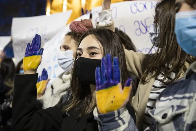 Young girls painted hands in the color of Ukranian flag, during a rally in support of Ukraine held in front of the Parliamenton February 26, 2022 in Tbilisi, Georgia. Georgians have held rallies since Russia started a war in Ukraine and begin its military operation on February 24th. (Photo by Daro Sulakauri/Getty Images)