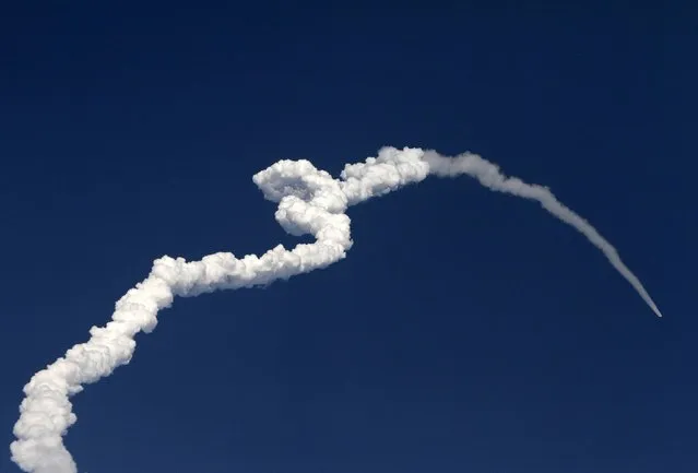 A contrail is seen as India's Polar Satellite Launch Vehicle (PSLV-C24), carrying the second navigation satellite of the Indian Regional Navigation Satellite System IRNSS-1B, lifts off from the Satish Dhawan Space Centre in Sriharikota, about 100 km (62 miles) north of the southern Indian city of Chennai April 4, 2014. (Photo by Reuters/Babu)
