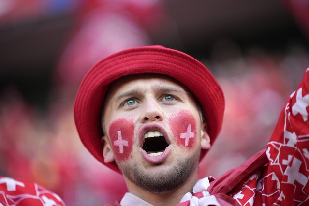 A Swiss fan cheers for their national team ahead of a Group A match between Scotland and Switzerland at the Euro 2024 soccer tournament in Cologne, Germany, Wednesday, June 19, 2024. (Photo by Alessandra Tarantino/AP Photo)