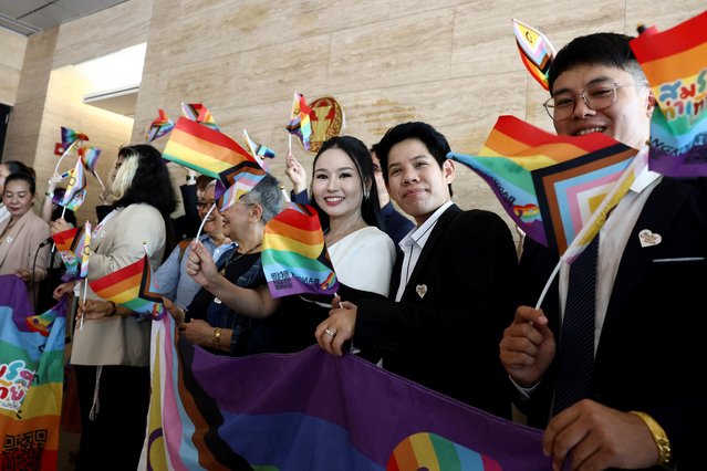 Members of the LGBTQ+ community react as they arrive ahead of the passing of the marriage equality bill in its second and third readings by the Senate, which will effectively make Thailand Asia's third territory to legalise same-s*x unions, in Bangkok, Thailand, on June 18, 2024. (Photo by Chalinee Thirasupa/Reuters)