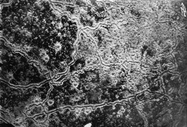 Aerial reconnaissance photograph showing a landscape scarred by trench lines and artillery craters. Photograph by pilot Richard Scholl and his co-pilot Lieutenant Anderer near Guignicourt, northern France, August 8, 1918. One month later, Richard Scholl was reported missing. (Photo by CC BY SA Carola Eugster via The Atlantic)