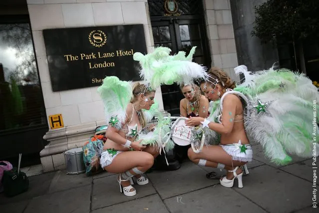 Members of The London School of Samba get ready to take part in a St Patrick's day parade