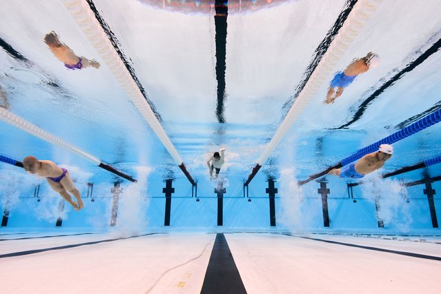 Weiyi Yuan of Team People's Republic of China (L), Kirill Pulver of Team Neutral Paralympics Athletes (C) and Jincheng Guo of Team People’s Republic of China (R) compete during the Swimming Men's 100m Freestyle S5 Heat on day two of the Paris 2024 Summer Paralympic Games at Paris La Defense Arena on August 30, 2024 in Nanterre, France. (Photo by Adam Pretty/Getty Images)