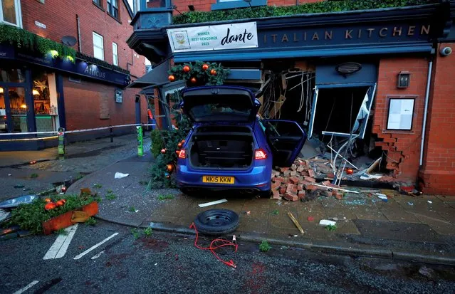 General view of a car that has crashed through the front window of an Italian restaurant in Hale in Manchester, Britain on December 19, 2019. (Photo by Phil Noble/Reuters)