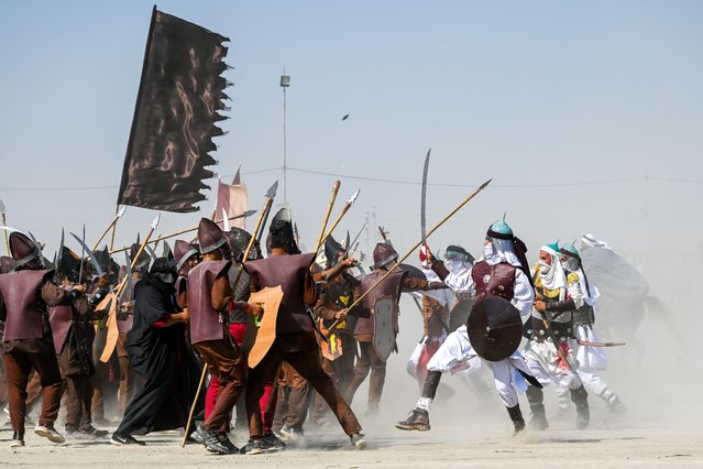 Performers stage reenactment of the historic Battle of Karbala, in which Imam al-Hussein, the grandson of the Prophet Muhammad, and his 72 companions who were martyred, on Ashura day, the 10th day of the month of Muharram, in Nasiriyah, Iraq on July 17, 2024. (Photo by Haidar Mohammed Ali/Anadolu via Getty Images)